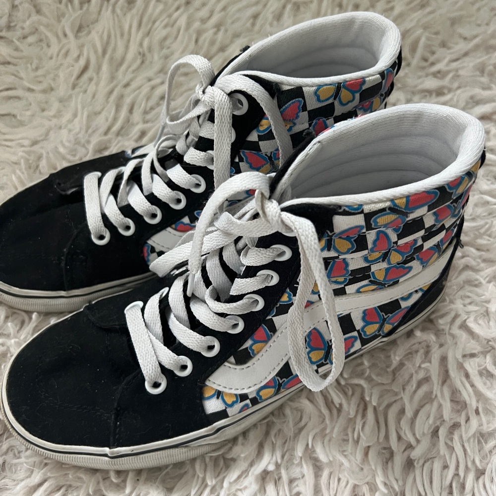 Black and white Vans high top sneakers with multi-coloured butterfly design
